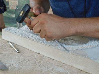 stonemason detailed chisel and hammer work 