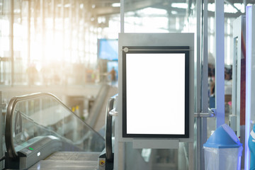 blank advertising billboard at airport,Mock up Poster media template Ads display in Subway station escalator