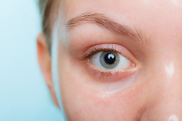 Close up woman in facial peel off mask.