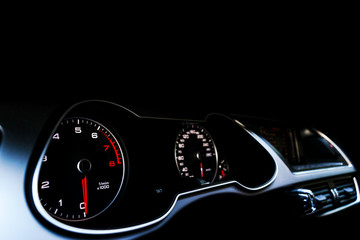 Close up shot of a speedometer in a car. Car dashboard. Dashboard details with indication lamps.Car...