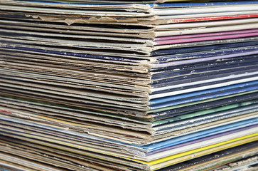 Stacked vintage vinyl record albums.