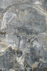 Gray surface of marble stone with striped streaks.