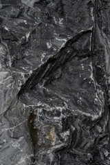 Gray surface of marble stone with striped streaks.