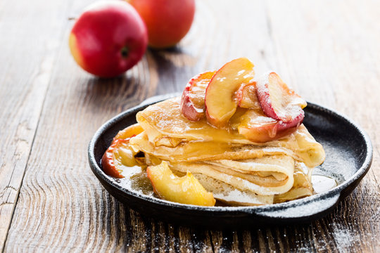Crepes  with fresh caramelized apples on top and apple sauce