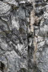 Gray surface of marble stone with striped streaks.