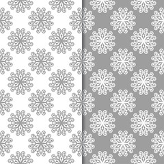 White and gray floral backgrounds. Set of seamless patterns