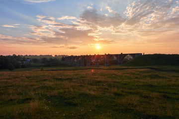Fototapeta premium Beautiful sunset and old railway bridge