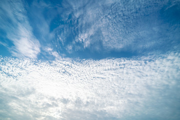 Clear blue sky with clouds background