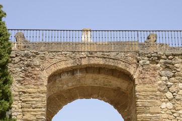 Fototapeta na wymiar Iron rail on stone arch, Antequera, Spain.