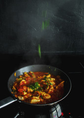 Vegetable stew, cooking chicken with vegetables. Process of cooking.