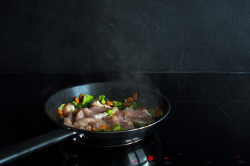 Vegetable stew, cooking chicken with vegetables. Process of cooking.