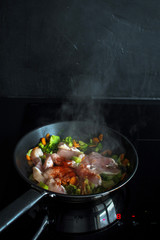 Vegetable stew, cooking chicken with vegetables. Process of cooking.