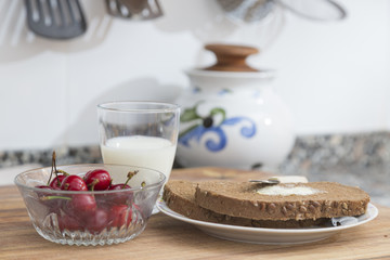 breakfast with milk, bread and fruit