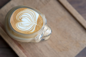 Hot coffee skull cup on wooden table
