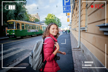 Beautiful happy young woman girl tourist hiker walks the streets in Helsinki, Finland, travel to...