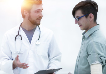 doctor gives advice to his patient