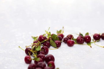 Ripe cherry on a light gray background, selective focus