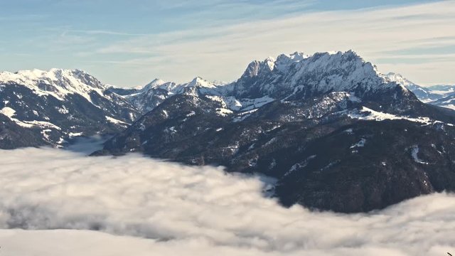 4k wide angle time lapse of clouds flowing through a valley.