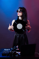Portrait dj headphone vinyl disk beach plays equipment summer disco girl party retro vintage pink...