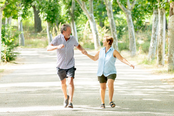 Fototapeta premium Happy senior couple walking and enjoying life outdoors