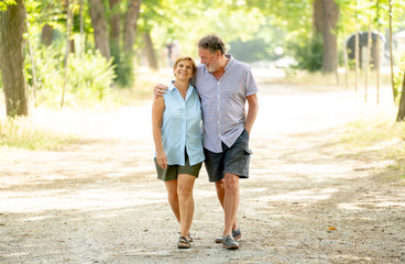 Happy senior couple walking and enjoying life outdoors