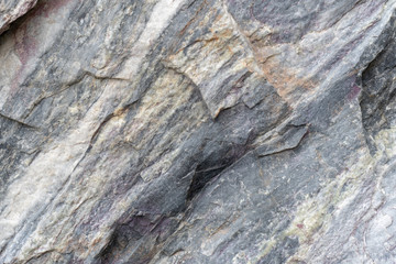 Gray surface of marble stone with striped streaks.