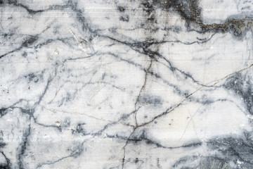 Gray surface of marble stone with striped streaks.