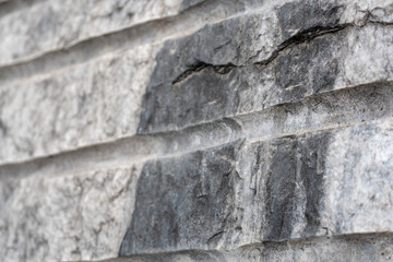 Gray surface of marble stone with striped streaks.