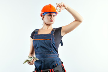 Young woman holding in one hand banknotes in another coin Bitcoin.
