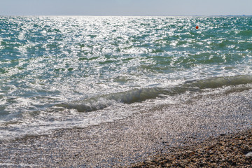 Beach with a wave in the summer Sunny day