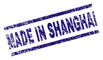 MADE IN SHANGHAI stamp seal watermark with grunge style. Blue vector rubber print of MADE IN SHANGHAI tag with unclean texture. Text tag is placed between parallel lines.