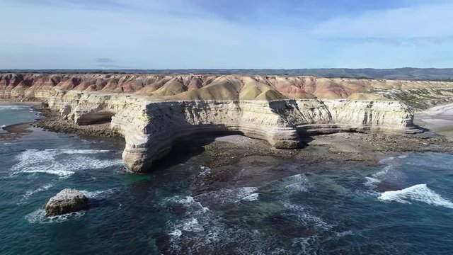 sliding drone shot of rocky coastline at Port Willunga in Adelaide, South Australia.