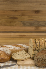 Whole grain bread on wooden background, healthy for dieting or breakfast