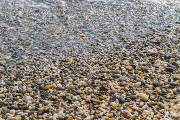 Sea stones on the seashore in the summer
