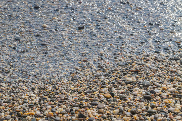 Sea stones on the seashore in the summer