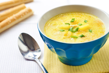 Cheese soup with chicken, potatoes and turmeric