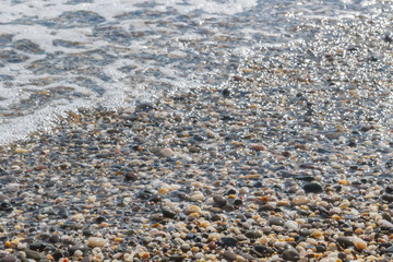 Sea stones on the seashore in the summer