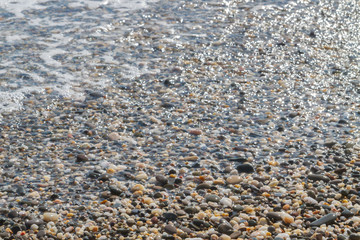 Sea stones on the seashore in the summer