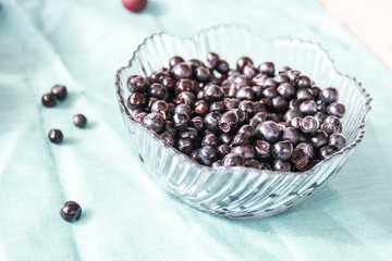Flatlay with raspberries, blueberries and gooseberries.