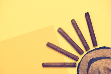 Straw panama hat and cuban cigars flat lay