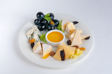 Parmesan cheese, camembert, brie and dor-blue on a white background
