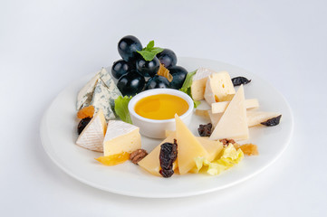 Parmesan cheese, camembert, brie and dor-blue on a white background