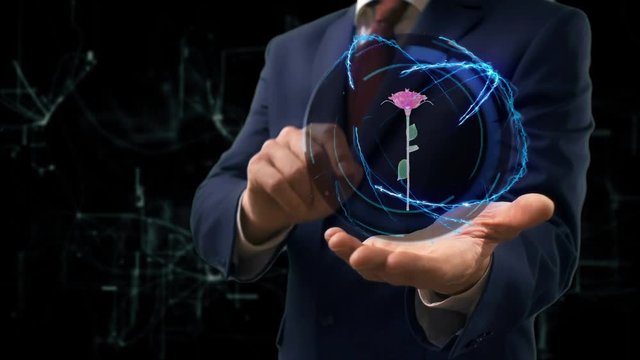 Businessman shows concept hologram 3d rose on his hand. Man in business suit with future technology screen and modern cosmic background