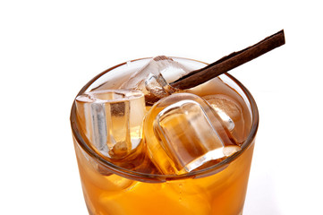 Whiskey-cola cocktail with ice on white background