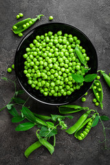 Green peas with pods and leaves