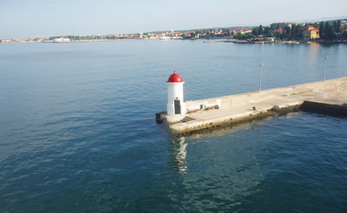 Lighthouse in the city harbor