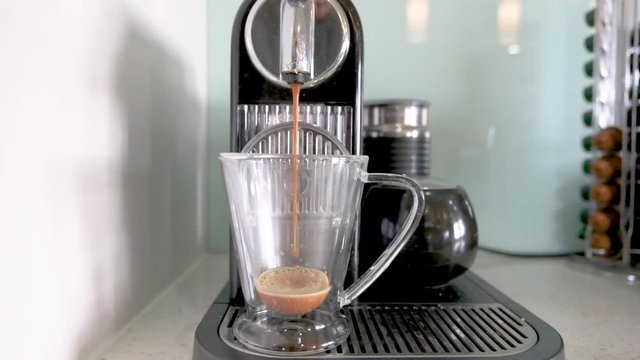 making coffee using Nescafe coffee machine, slow motion