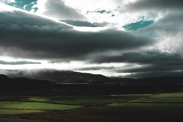 Obraz premium A field covered by dark clouds in Iceland