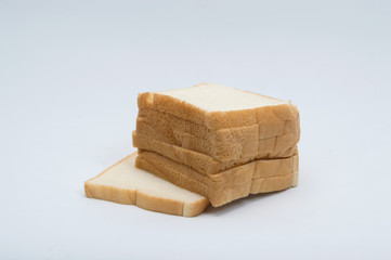 cutting wheat bread  isolated on a white background