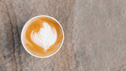Cup of cuppuccino on stone textured background